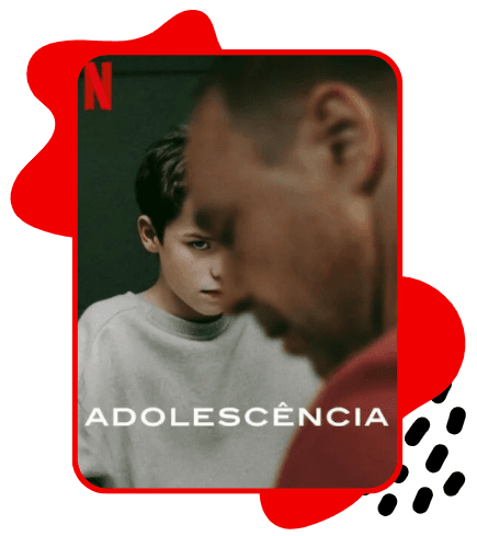 Pôster da série Adolescência, mostrando um garoto com expressão séria e olhar intenso ao fundo, enquanto em primeiro plano aparece um homem adulto desfocado, de perfil. A cena tem iluminação escura e tom dramático. No canto superior esquerdo está o “N” da Netflix, e na parte inferior aparece o título “Adolescência”. O pôster está emoldurado por uma borda vermelha com elementos gráficos abstratos vermelhos e pretos ao redor.